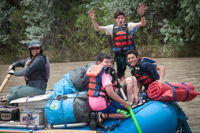 Grand Canyon Youth guide on a boat with kids