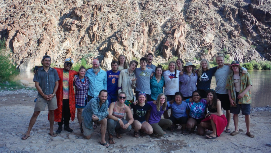 Grand Canyon Youth group stands for a photo by the river